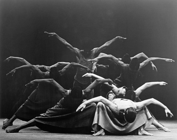 Alvin Ailey dancers performing in a sculptural ensemble formation