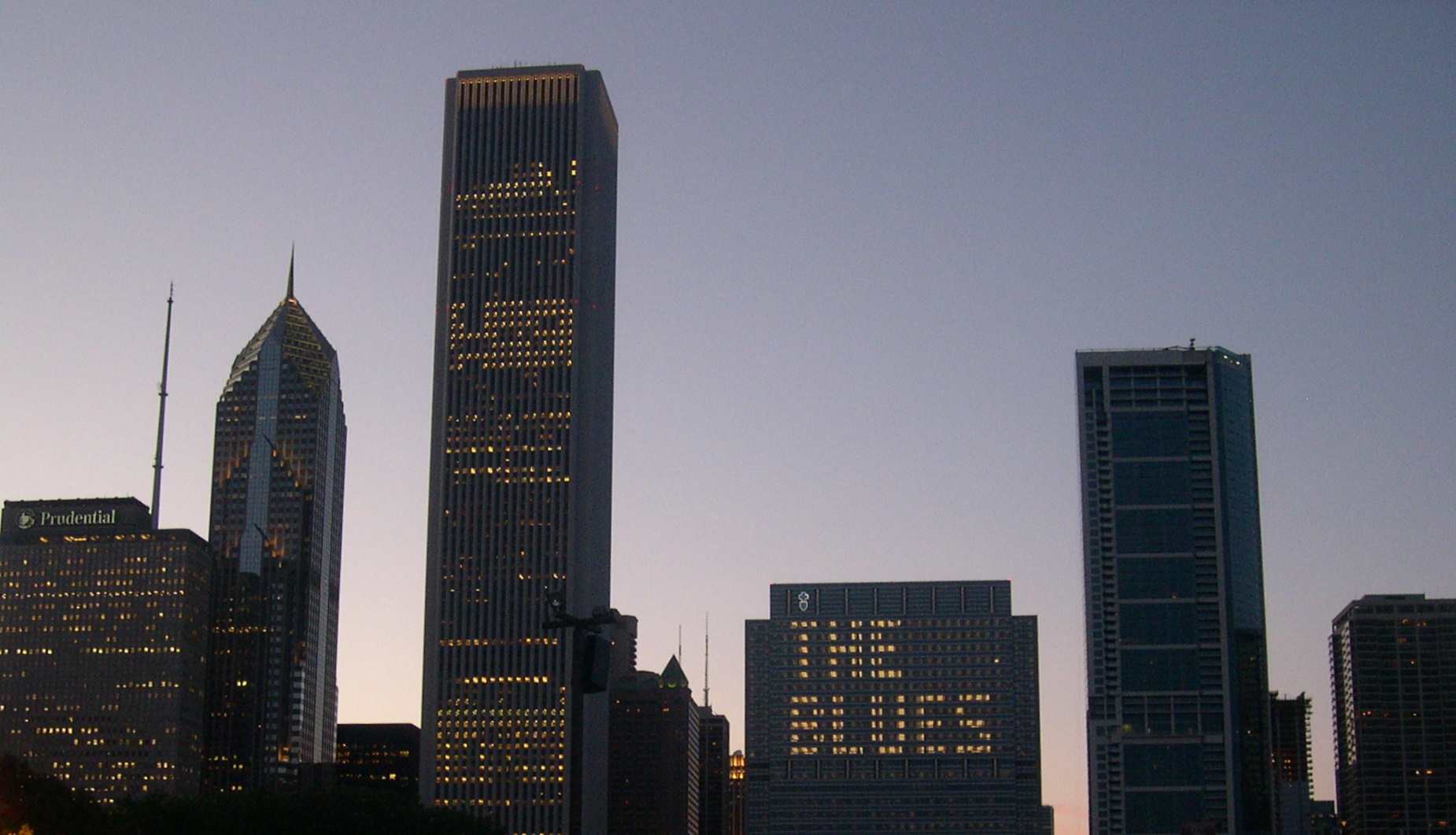 Chicago skyline with THE BLUES illuminated across the windows of a downtown building